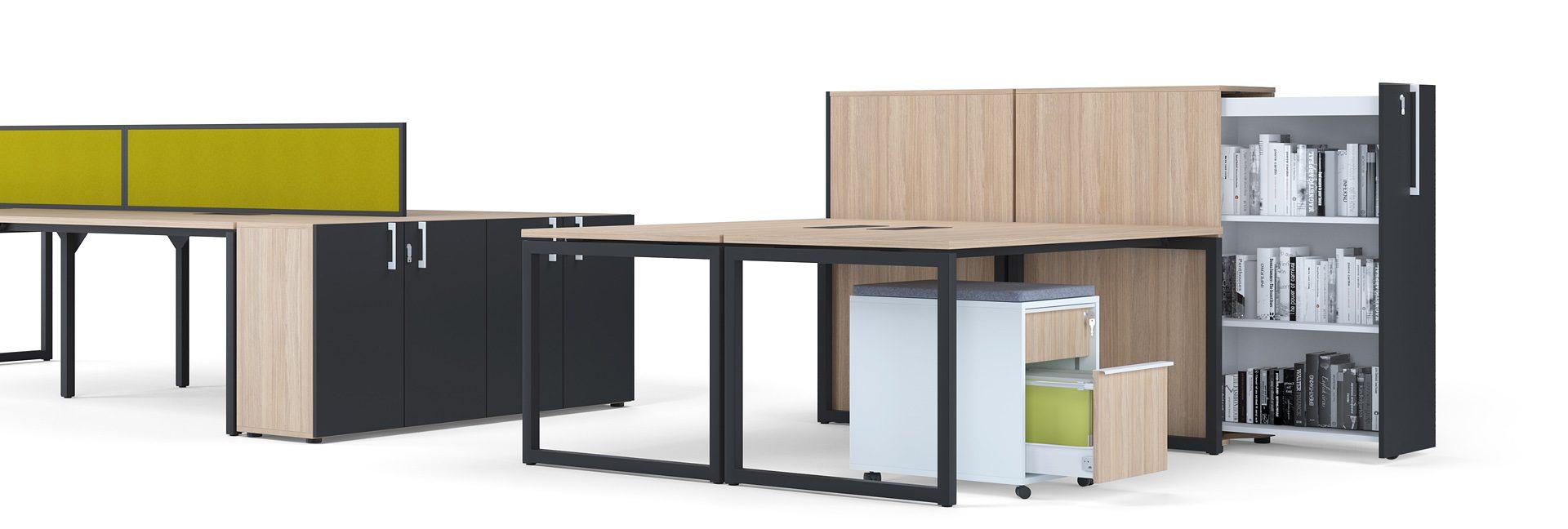 Assortment of FortyO solo and bench desks with black frames and amber oak worktops