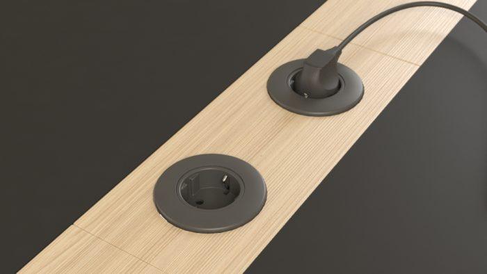Close up of Nova Wood meeting table showing central wooden cable panel with inset power outlets