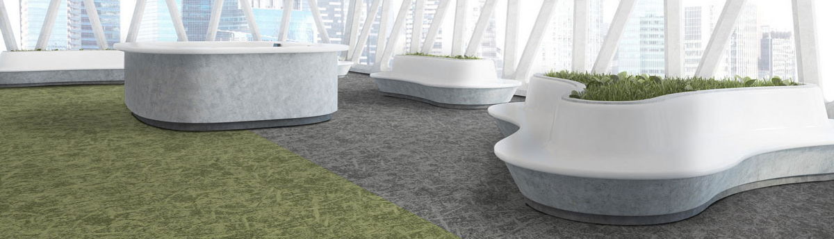 Osaka Range of Carpet tiles in reception and lounge waiting area of large corporate office building. In multiple patterned colours of greens and greys