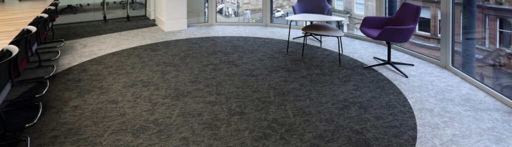 Osaka carpet tiles fitted in circular pattern within rounded office