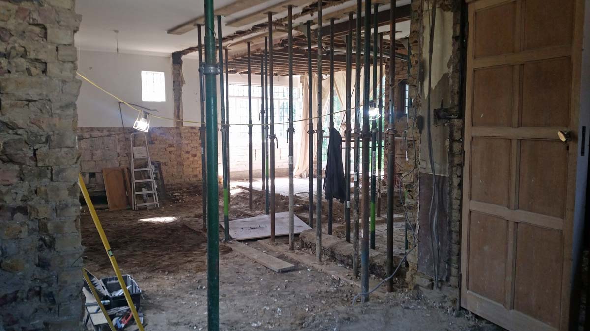 House Alterations in East Sheen. Walls being removed with ceiling propped up by Acrow bars